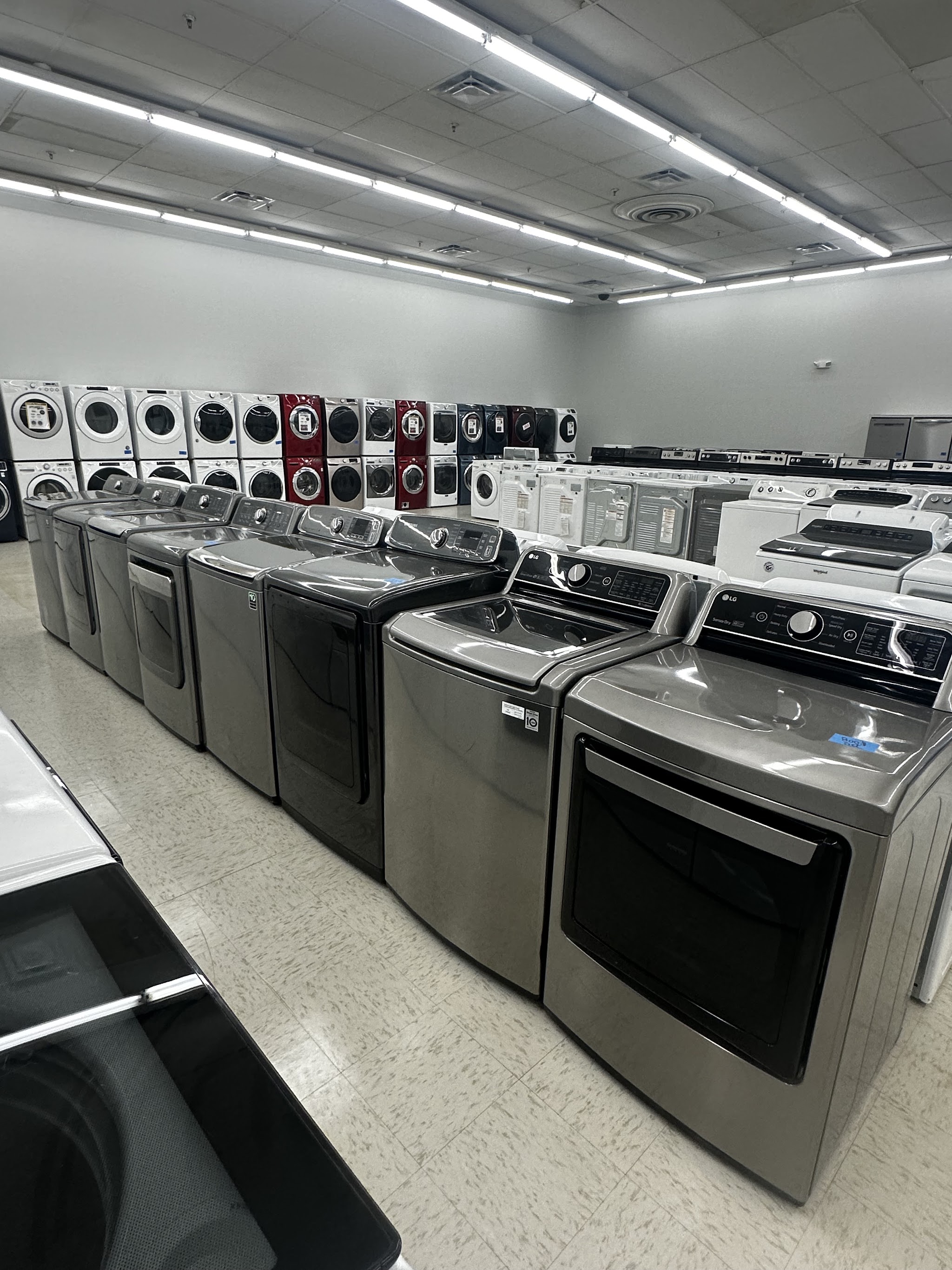Top-load washers and ranges in our showroom aisle